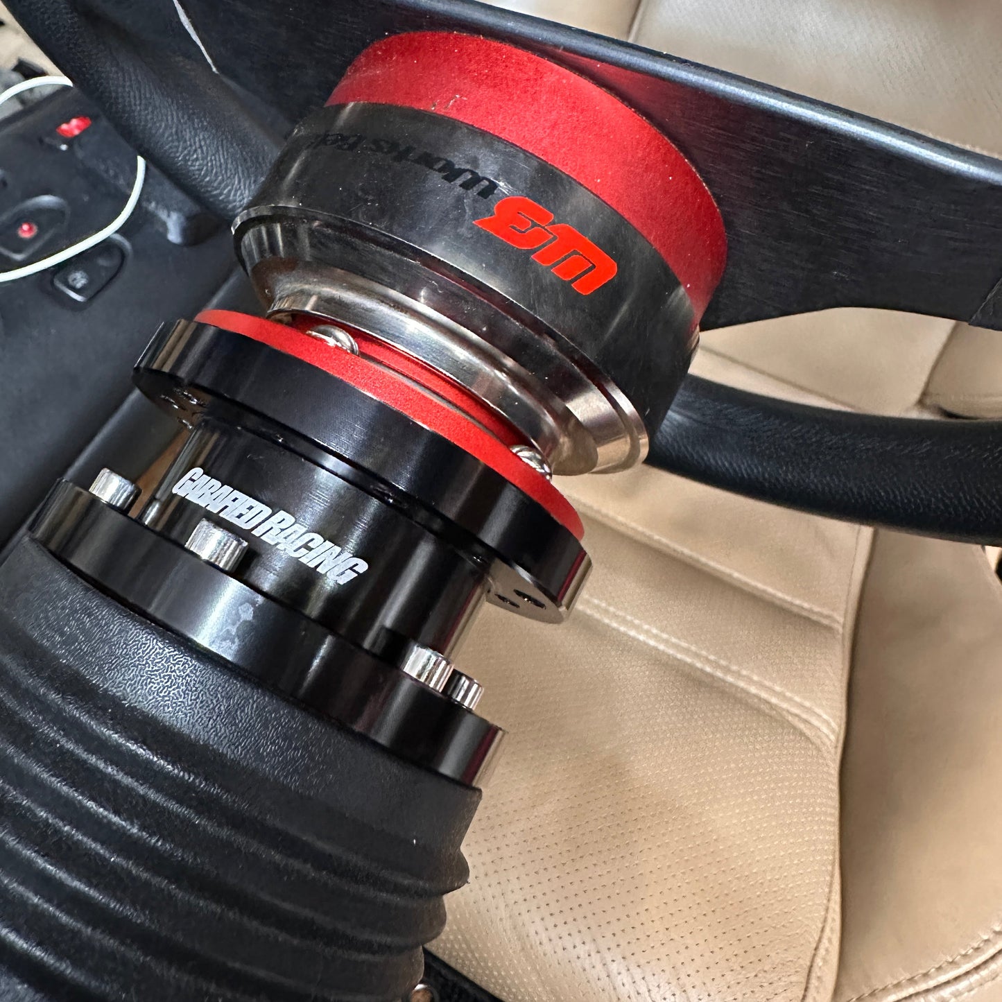 Close-up of a car steering wheel with a steering wheel spacer installed